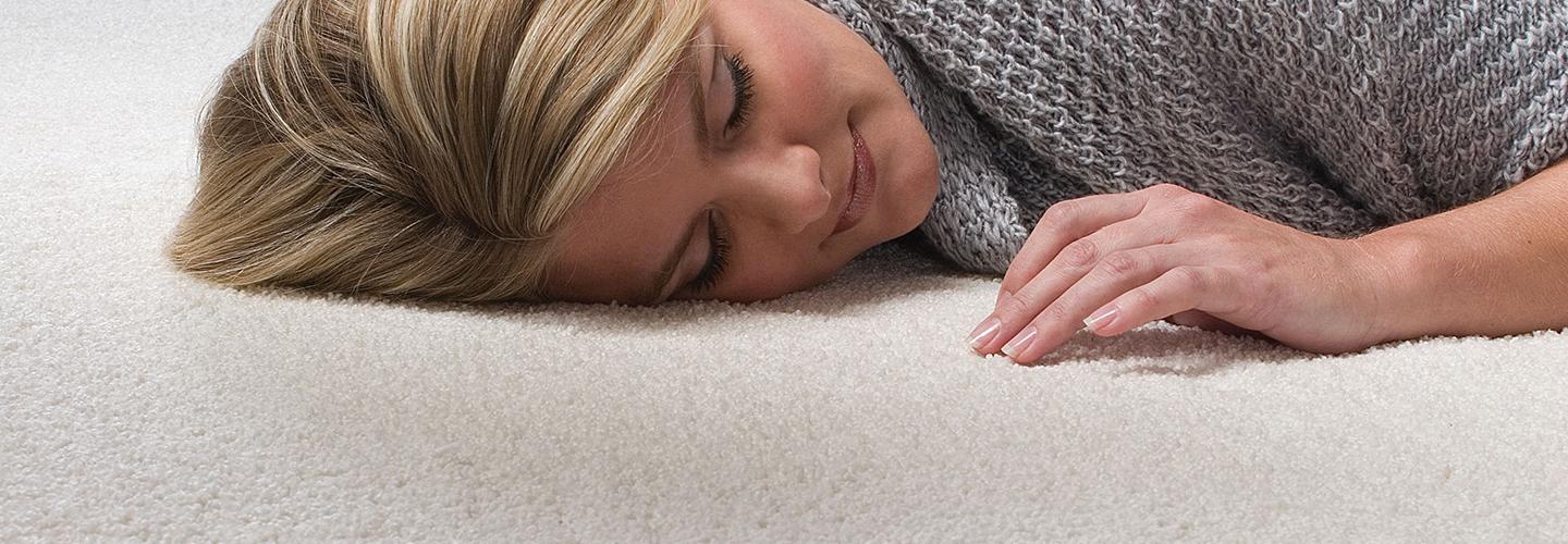 Woman lying on beige Infinity nylon carpet
